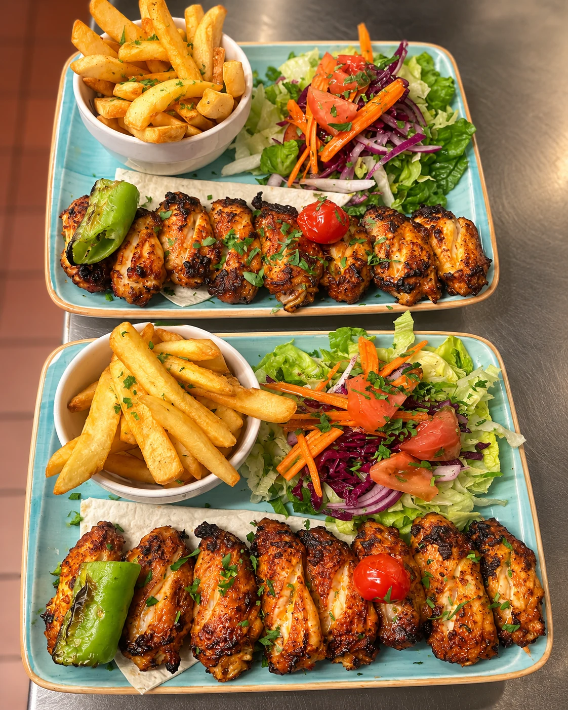 Grilled chicken wings with chips and salad